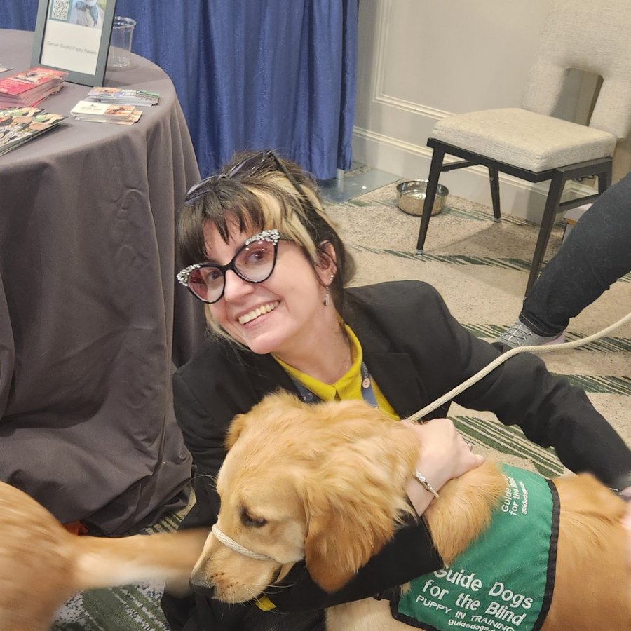 Samantha K. Miller Gurski, Director of Continuing and Professional Education, with a Guide Dogs for the Blind ambassador